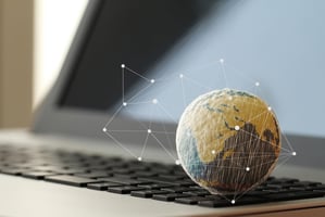 world ball in front of a laptop