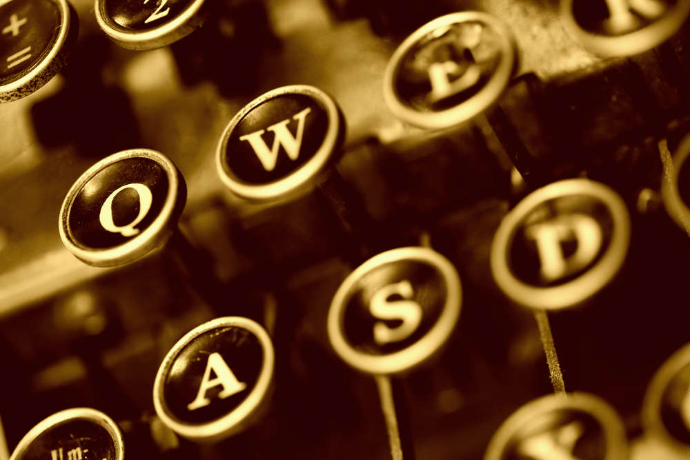 typewriter for old words in sepia tone